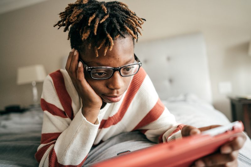 Social media and teens homework Teen with tablet